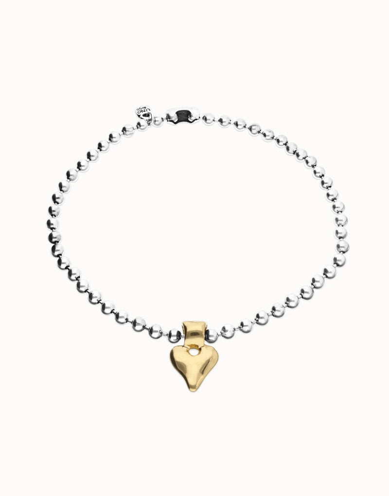 UNOde50 silver plated beaded necklace with gold plated heart pendant, front view.