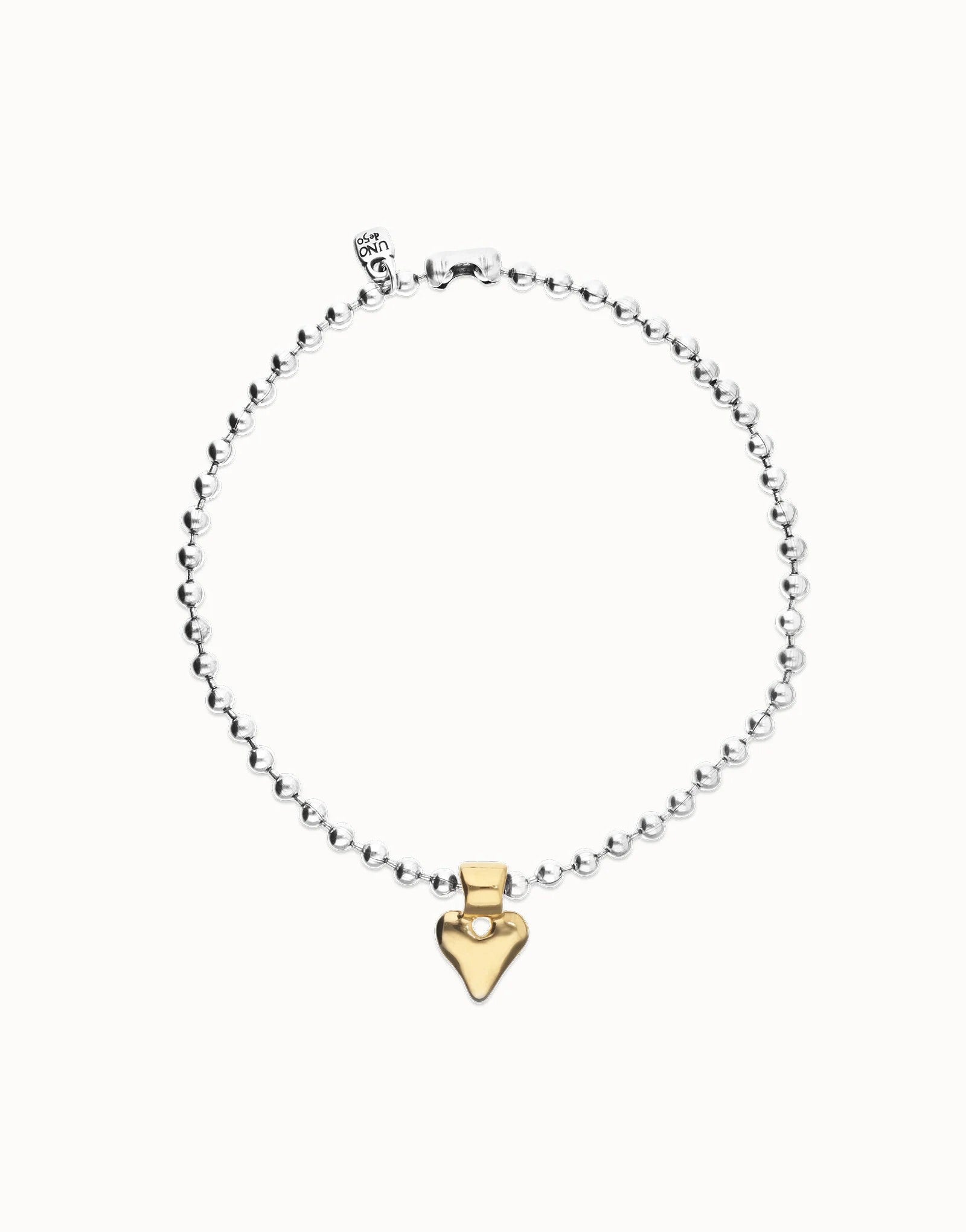 UNOde50 silver plated beaded necklace with gold plated heart pendant, front view.