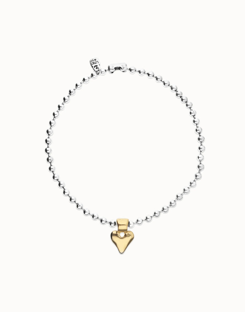 UNOde50 silver plated beaded necklace with gold plated heart pendant, front view.