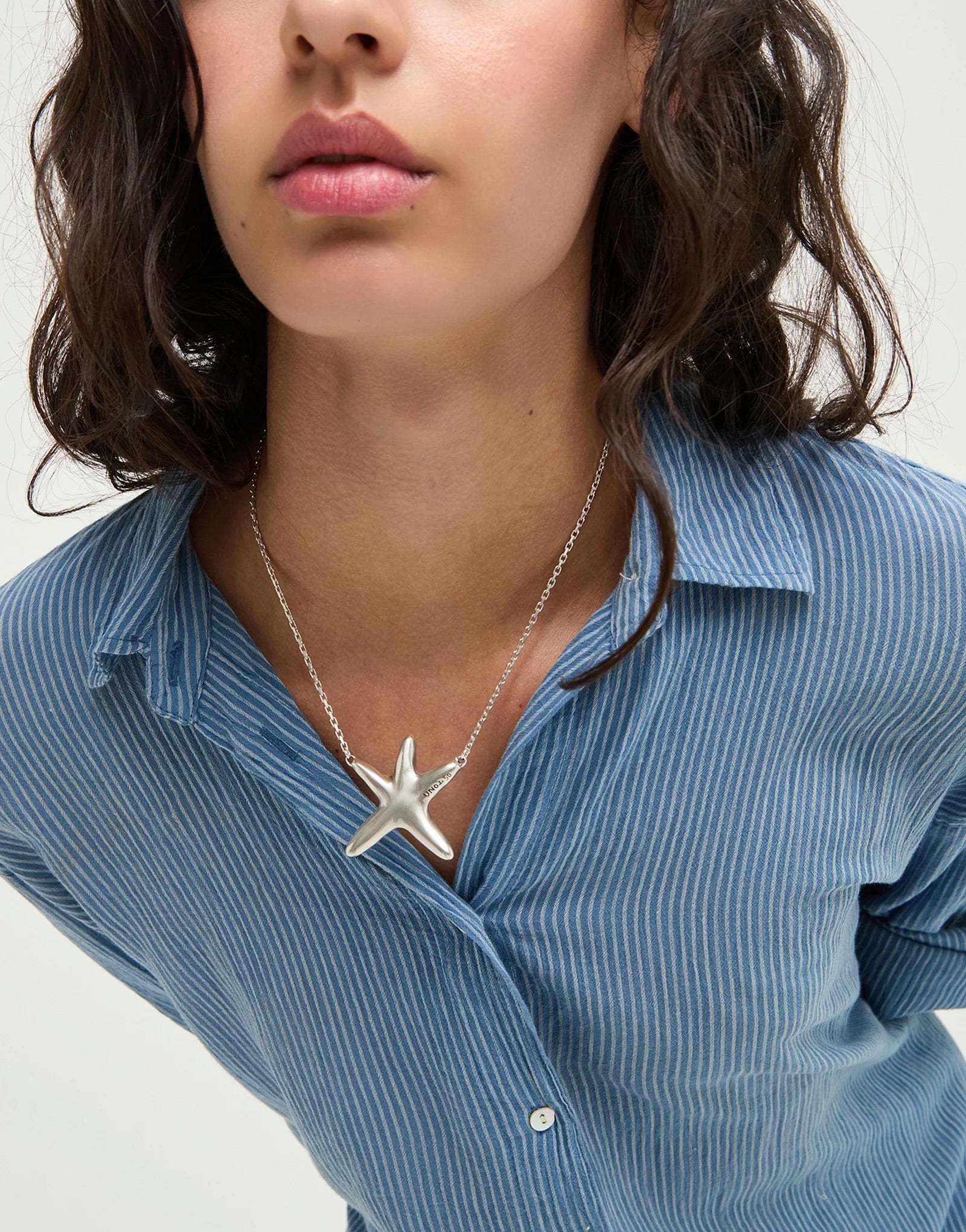 UNOde50 silver plated starfish pendant necklace with polished organic starfish design, front view.