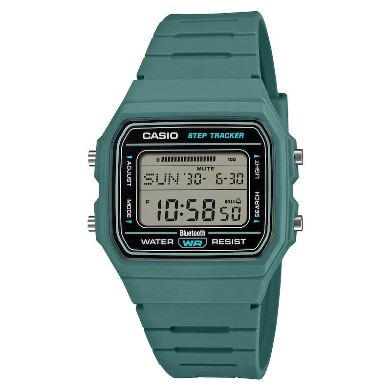 A Casio step tracker digital watch with a teal green resin strap and case, featuring a black face with blue and white text and a digital display showing the time and step count.
