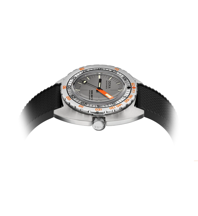 Low side view of the DOXA SUB 300 Ti5 Clive Cussler watch, highlighting the case profile, bezel, crown and black rubber strap.
