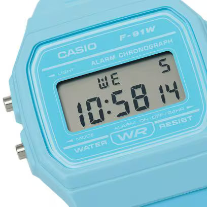 Close-up of blue Casio F-91W digital watch face with LCD display and alarm chronograph detailing.