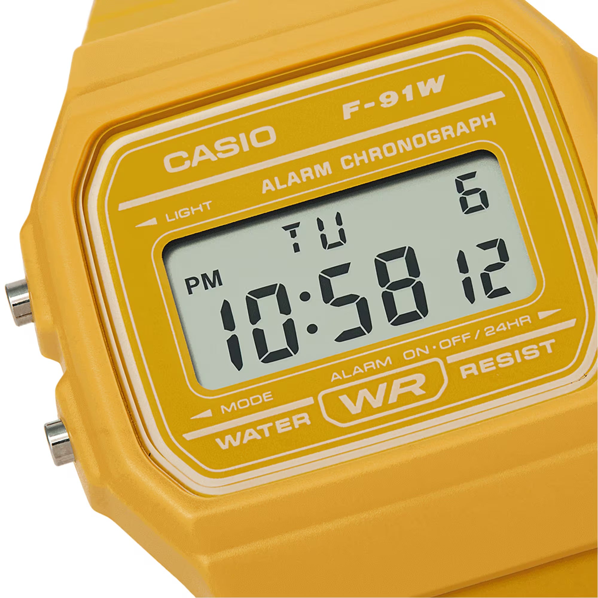 A close-up of a Casio F-91W alarm chronograph watch with a bright yellow plastic case and a light gray digital display screen.