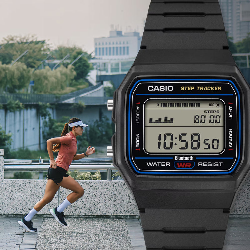 A close-up of a black Casio step tracker watch with a blue and yellow bezel overlaying a lifestyle scene of a woman jogging outdoors.