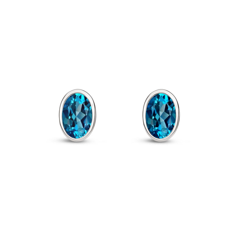 9ct White Gold London Blue Topaz Oval Rubover Stud Earrings 6x4mm