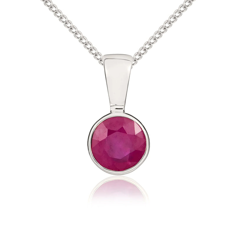 9ct white gold pendant featuring a round faceted ruby in a rubover setting, suspended from a white gold chain.