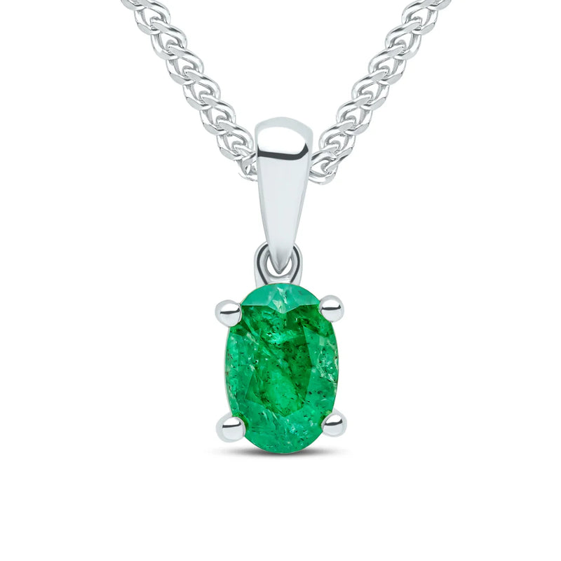 9ct White Gold pendant featuring an oval Emerald gemstone in a classic four claw setting, suspended from a White Gold chain.