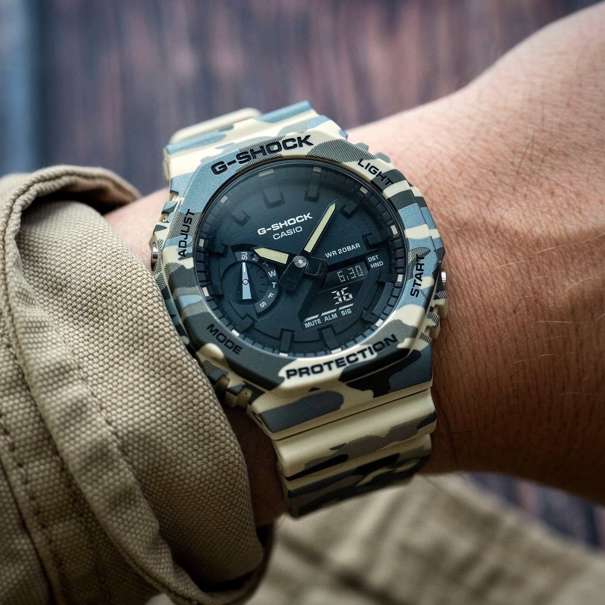 Casio G-Shock GA-2100CM-5A analogue-digital watch with beige camouflage resin case and strap, front view.