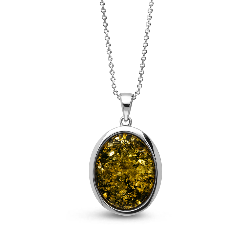 Sterling silver handmade oval pendant featuring green Baltic amber on a sterling silver chain against a white background.