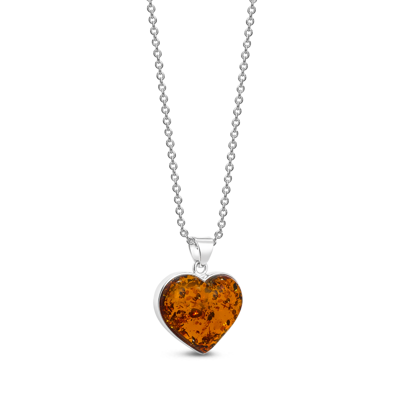 A heart-shaped amber pendant necklace on a silver ball chain, shown against a plain white background.