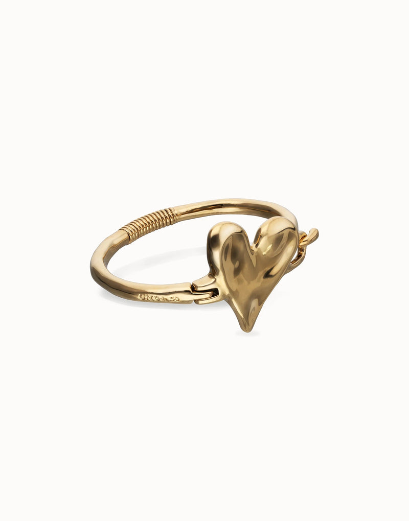 UNOde50 gold plated heart bangle front view with polished heart centre and semi-rigid bracelet design.