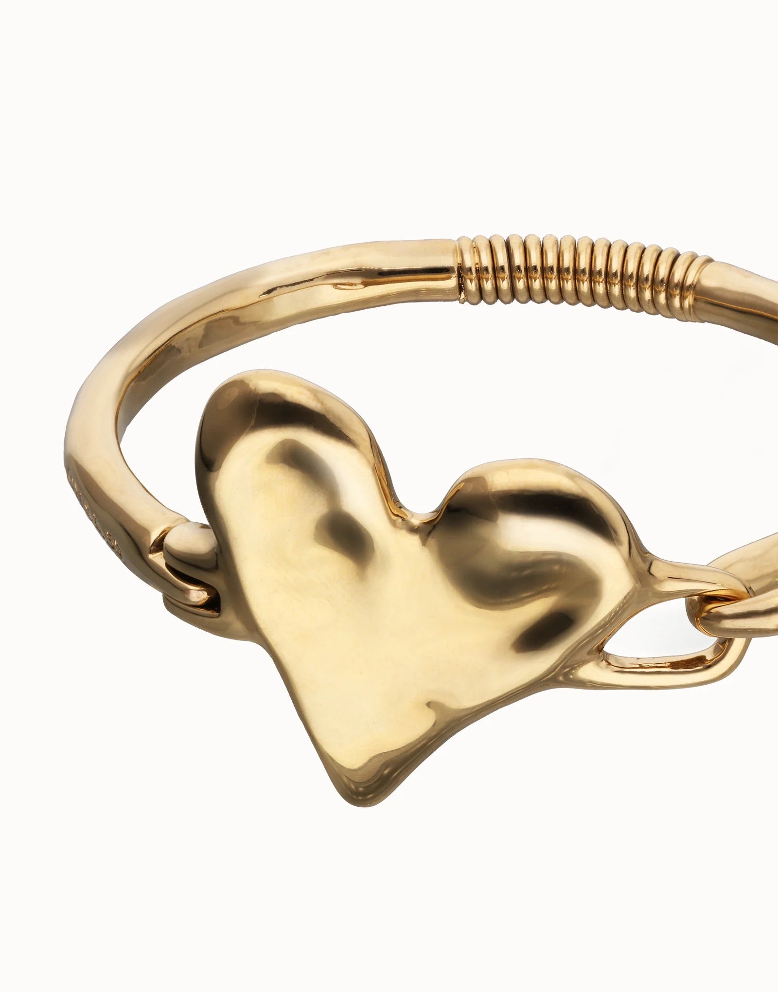 UNOde50 gold plated heart bangle front view with polished heart centre and semi-rigid bracelet design.