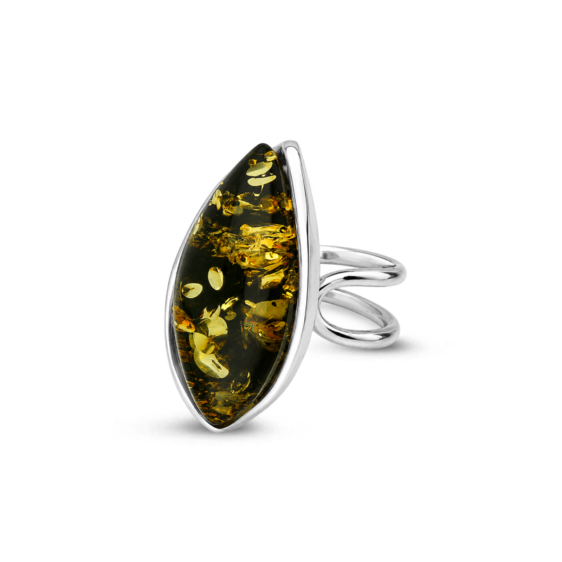 Handmade sterling silver ring featuring a large green Baltic amber stone in a flowing open silver setting on a white background.