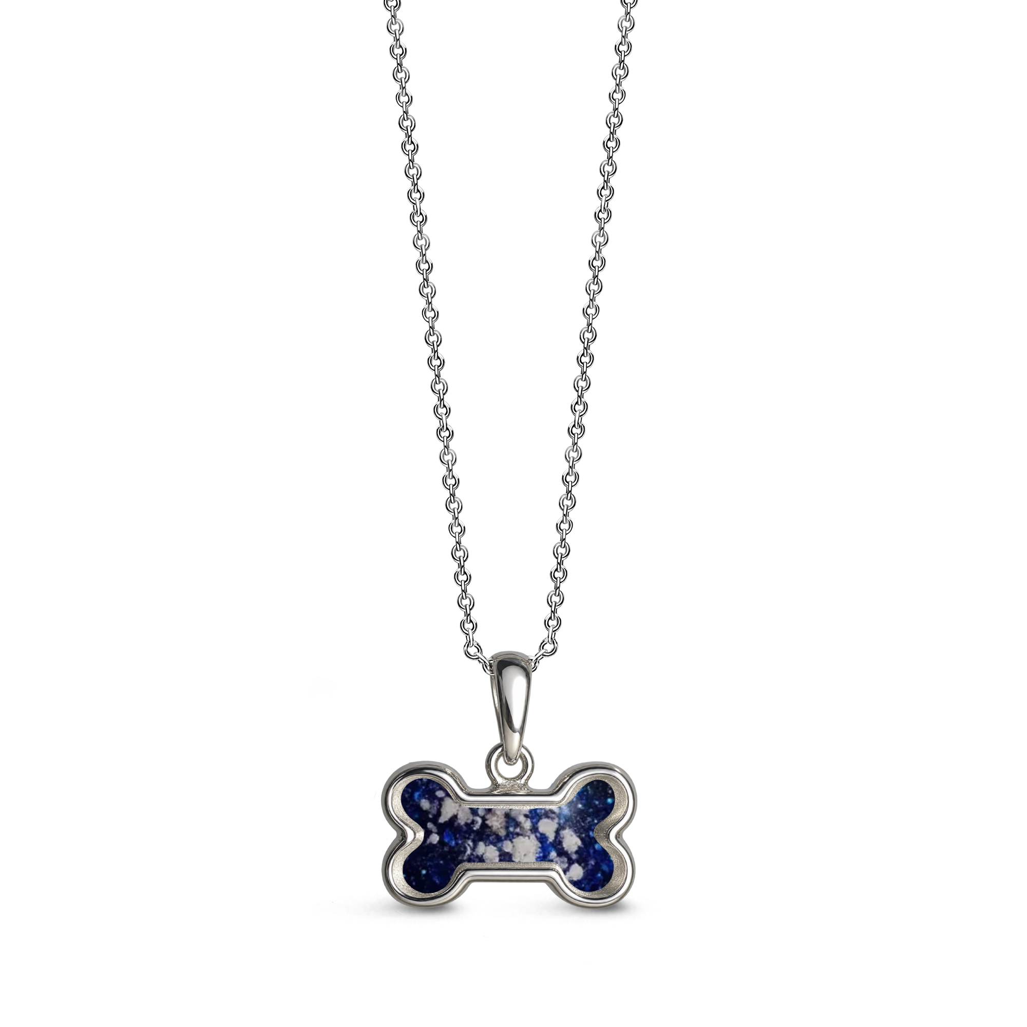 Sterling silver dog bone-shaped ashes keepsake pendant necklace featuring a sapphire glitter memorial setting with incorporated ashes and a polished silver border.