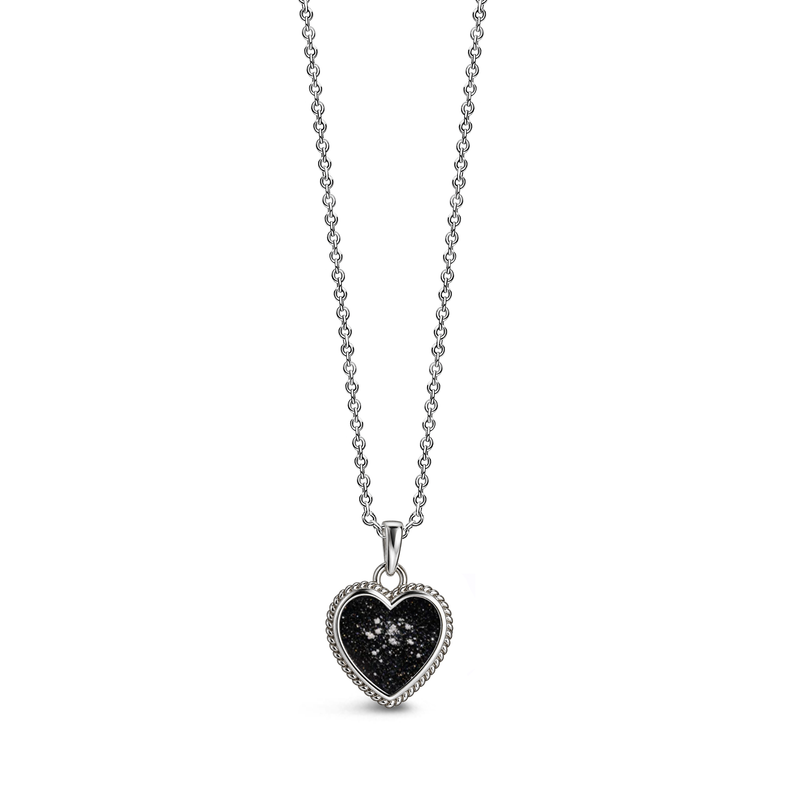 Sterling silver heart-shaped ashes keepsake pendant necklace featuring a black glitter memorial setting with incorporated ashes and a decorative rope-style border.