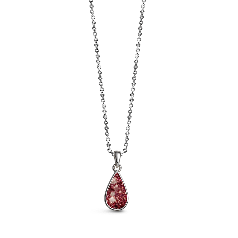Sterling silver teardrop-shaped ashes keepsake pendant necklace featuring a ruby glitter memorial setting with incorporated ashes and a polished silver border.