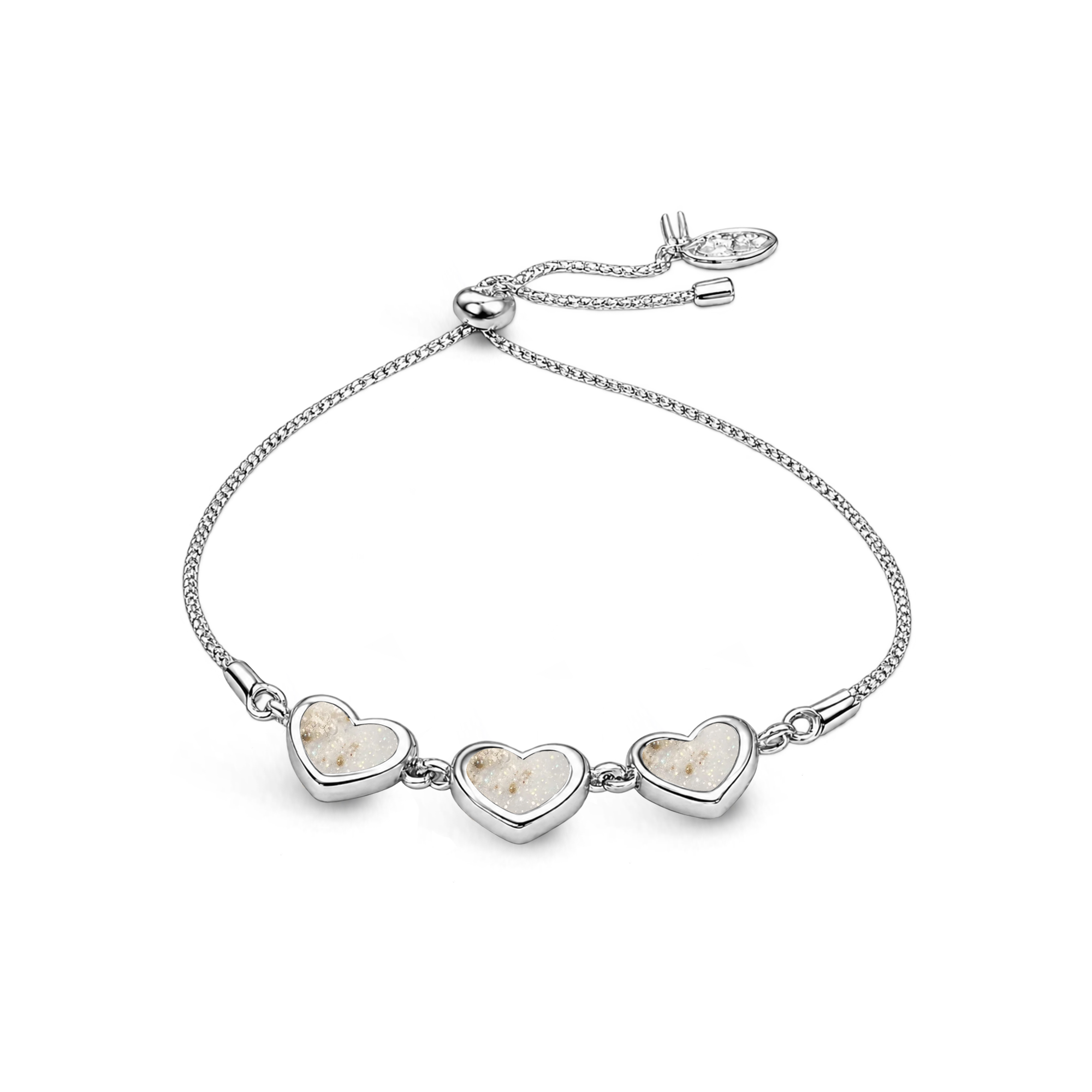 Sterling silver three-heart ashes keepsake bracelet featuring pearl glitter memorial settings with incorporated ashes and an adjustable slider fastening.