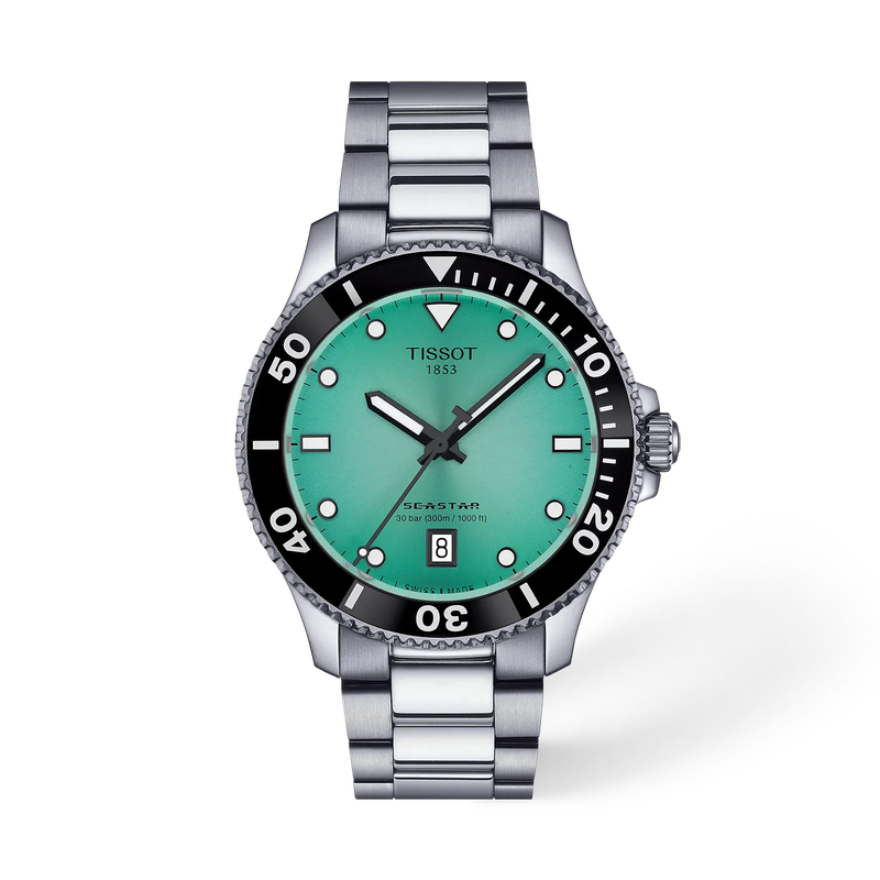 Tissot Seastar watch with a silver stainless steel link bracelet, a black rotating bezel, and a vibrant green dial.