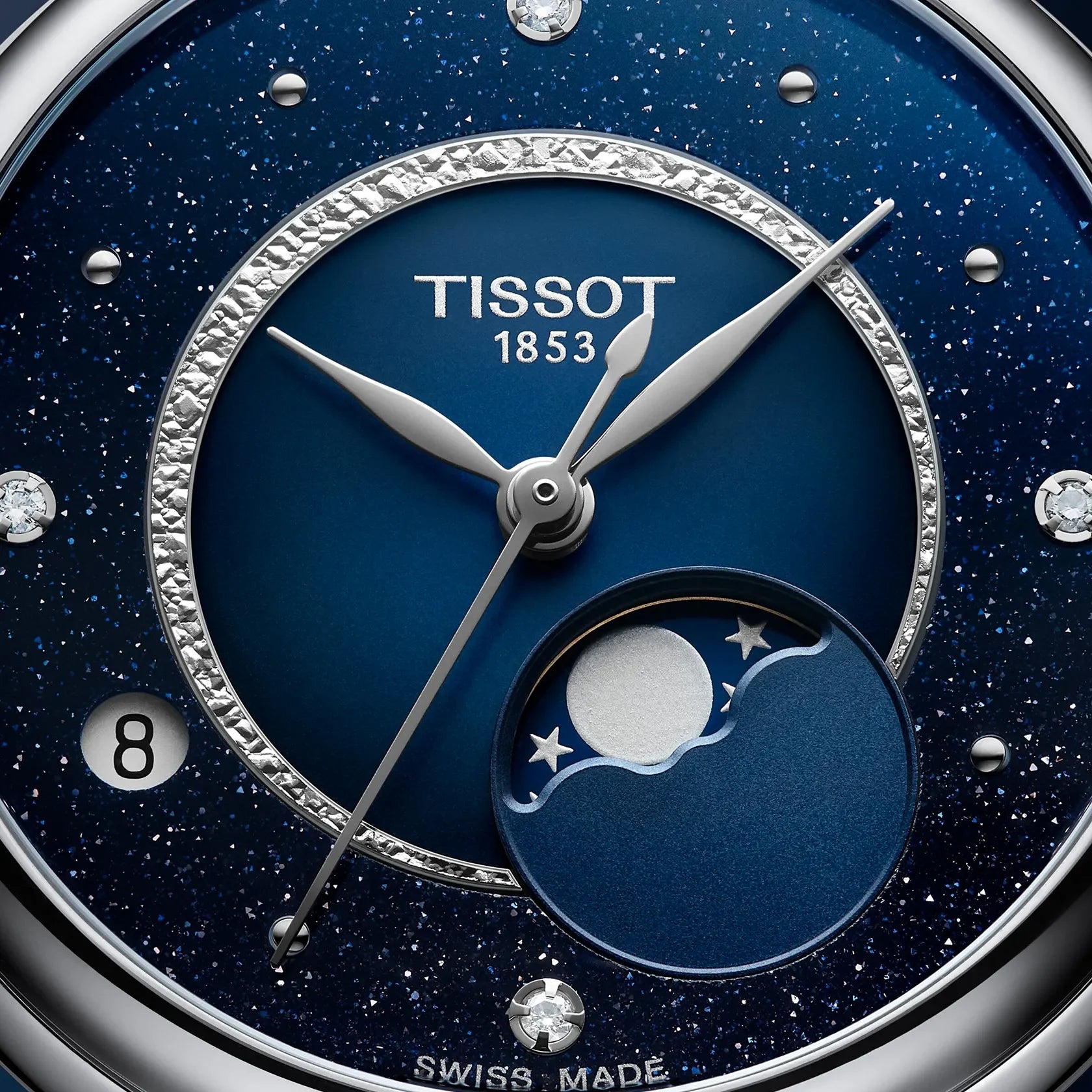 Tissot women’s watch close-up with blue moonphase dial, diamond markers and date display