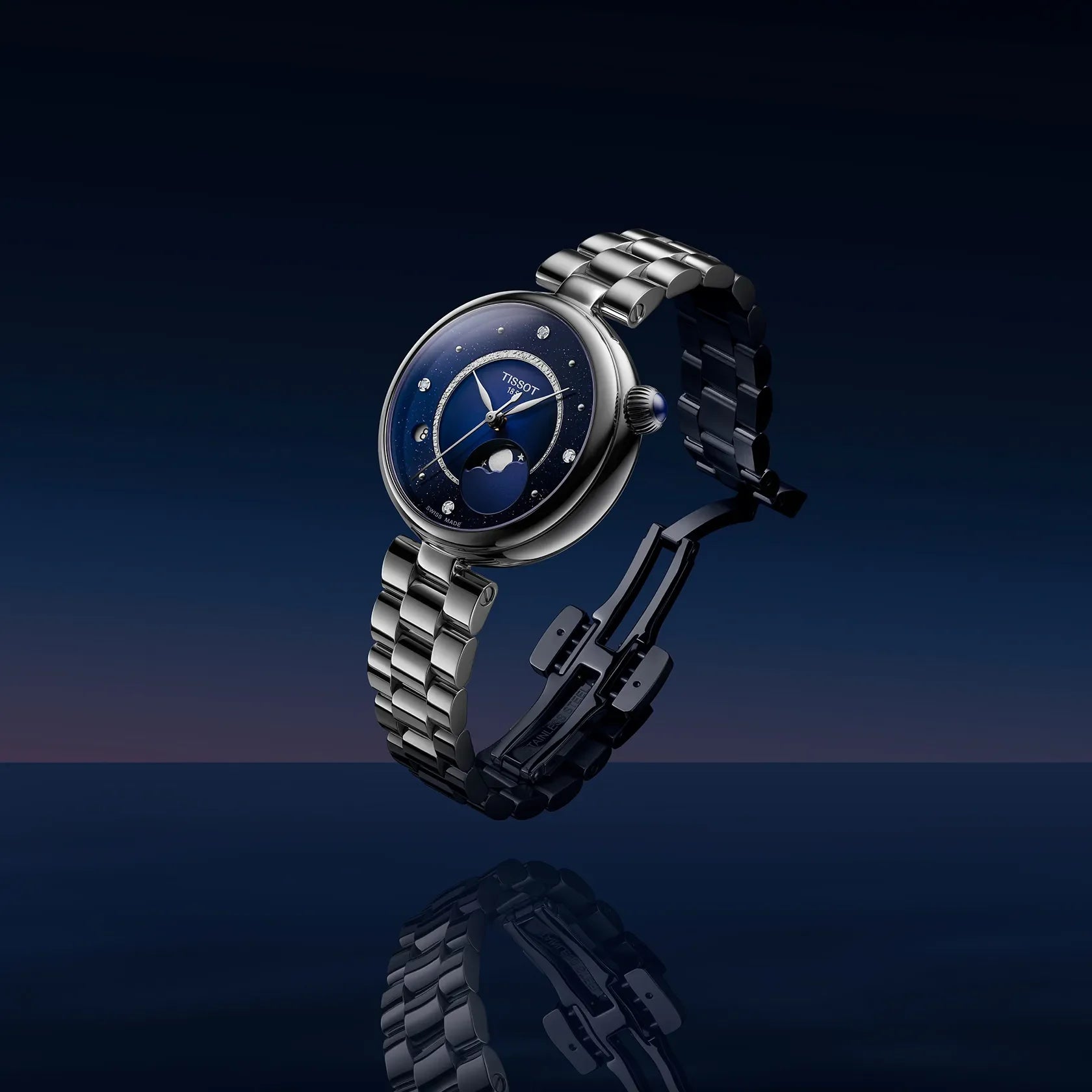 Tissot women’s stainless steel watch with blue moonphase dial and open butterfly clasp