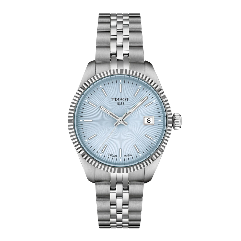 Tissot stainless steel watch with an ice blue textured dial, fluted bezel, silver-tone hands and date display.