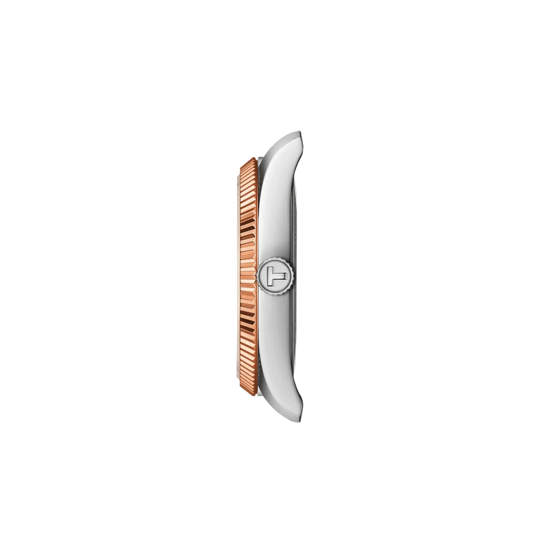 Side view of the Tissot Ballade T156.010.22.031.01 watch showing the polished stainless steel case, rose gold PVD fluted bezel and Tissot engraved crown.