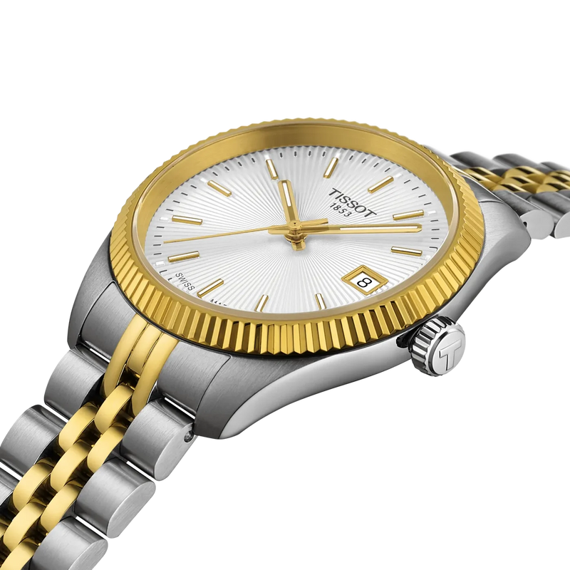 Close-up of the Tissot Ballade T156.210.22.031.00 showing the silver sunray guilloché dial, gold-tone hands, fluted bezel and date display.